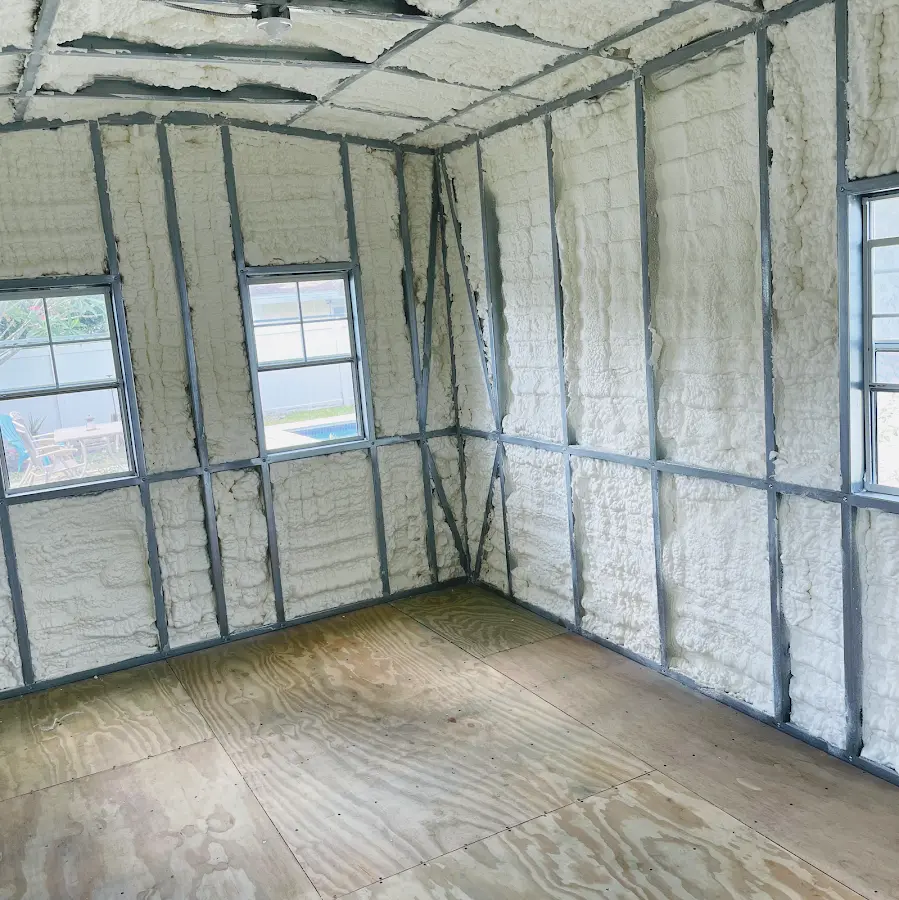 Closed-cell spray foam insulation applied to wall cavities in a residential project in Friendly